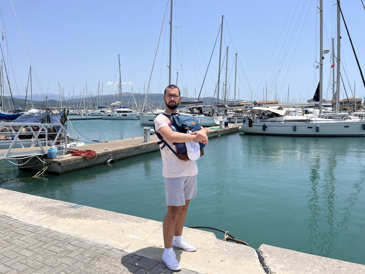 Sergio standing by a pier in Lefkada, Greece