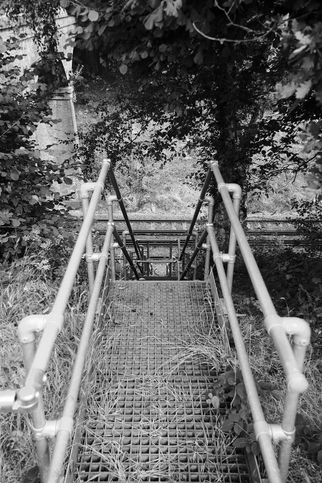 Stairs leading down to a railway track